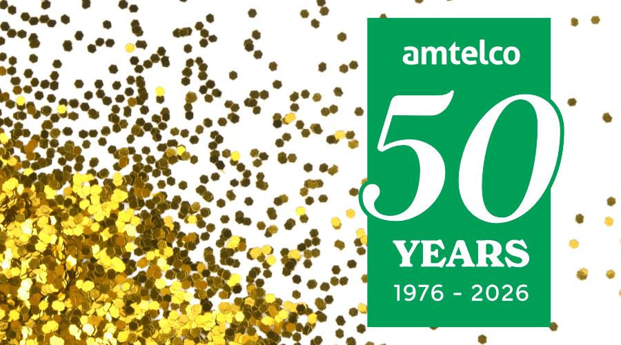 Amtelco's 50th anniversary logo among gold glitter.