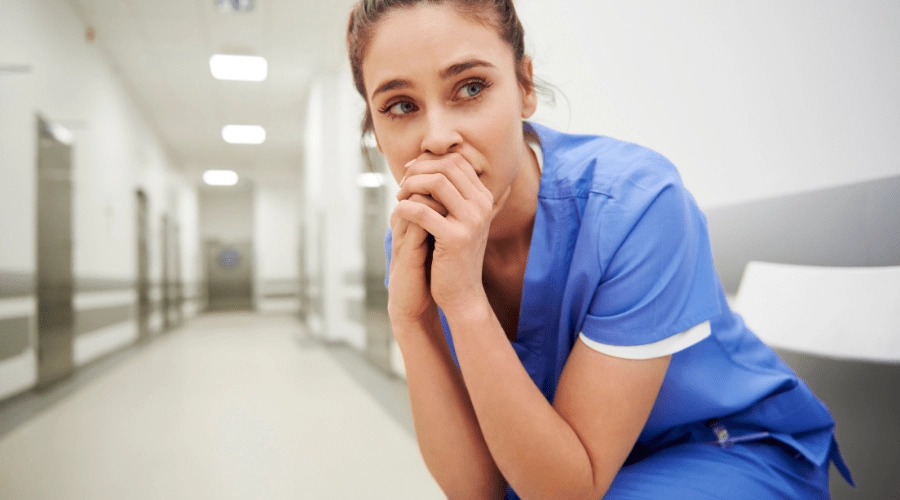 A healthcare worker shows concern about workplace violence.