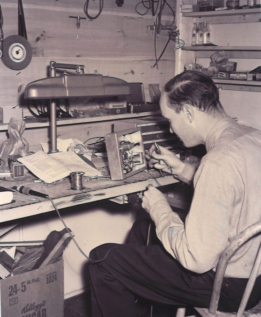 Bill Curtin working on telecommunications equipment.