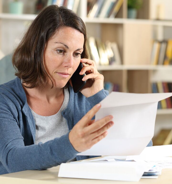 Woman on the phone speaking with answering service receptionist
