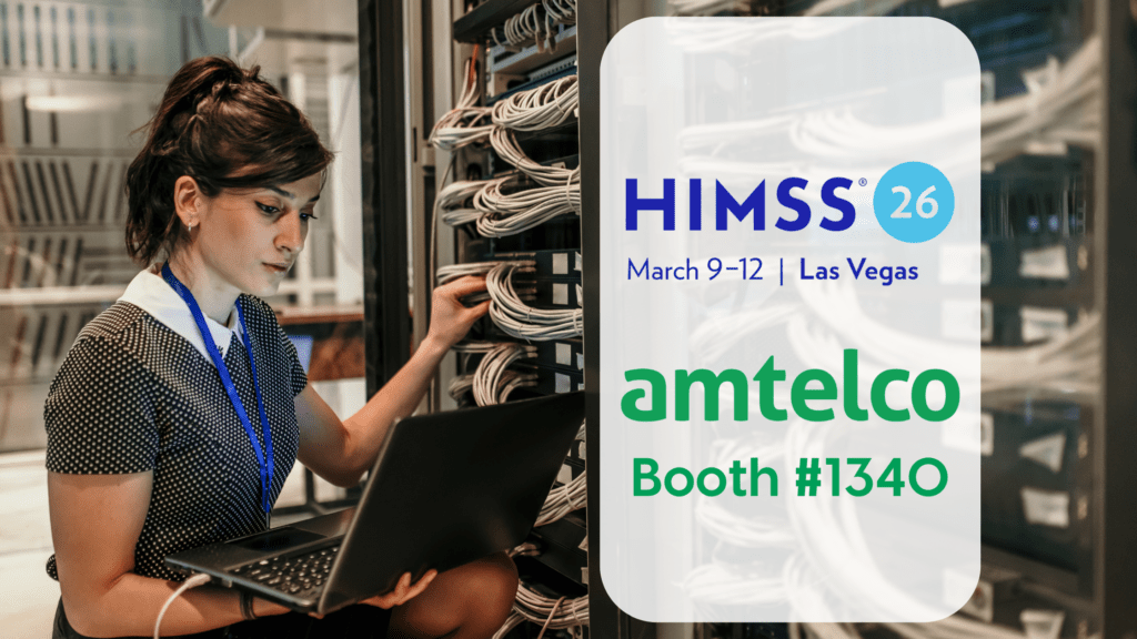 A woman works in a server room.