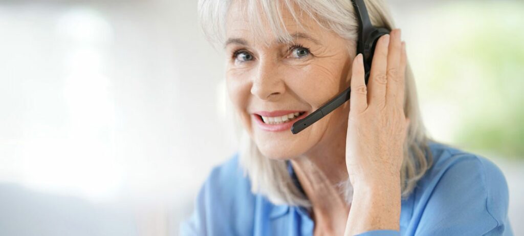 An operator works from home while answering COVID-19 questions.