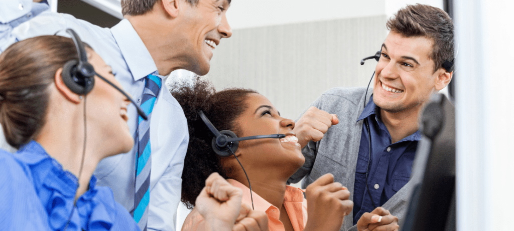 A group of contact center operators celebrate their leaderboard rank.