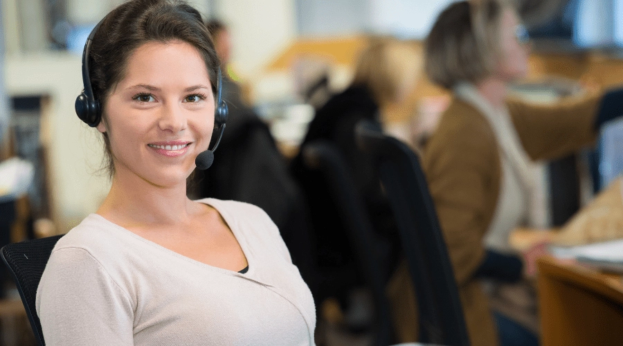A happy hospital call center operator at work.