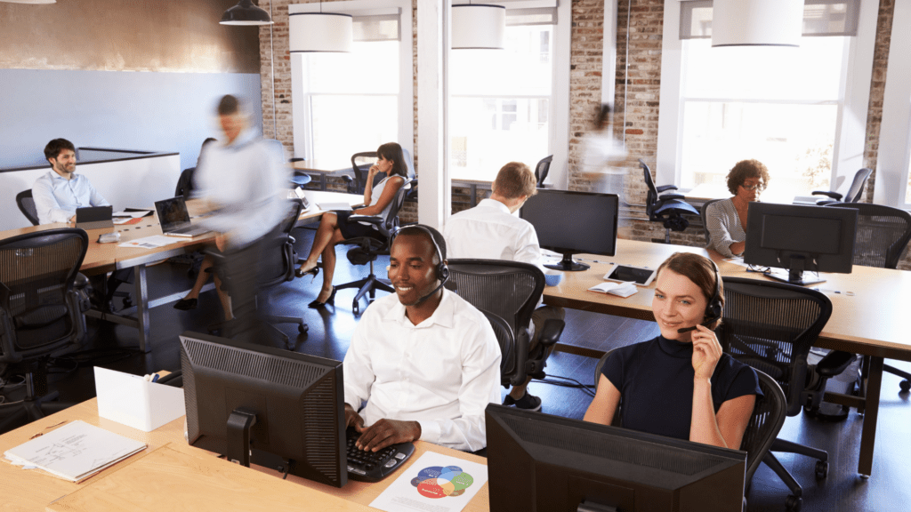 A group of transfer coordinators work at a patient transfer center.