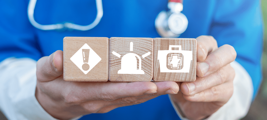 Emergency concept with wooden blocks.