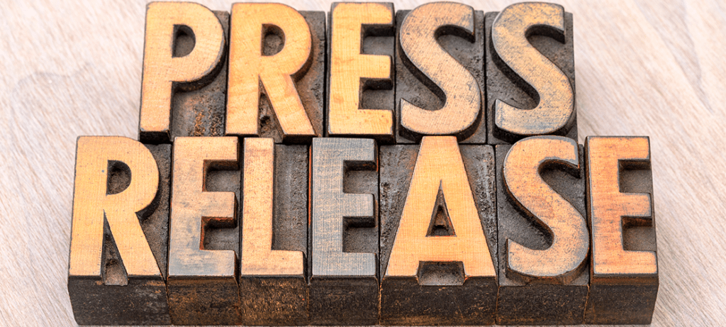Printing press letters spell Press Release.