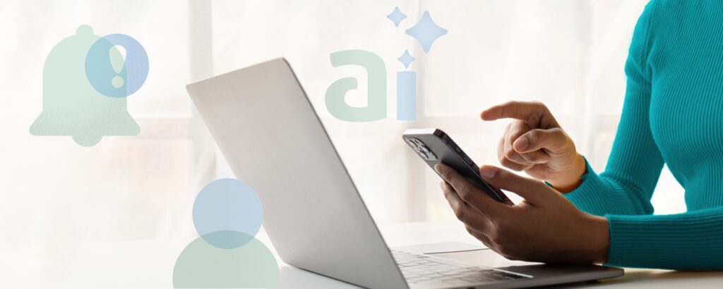 Woman on phone at a laptop