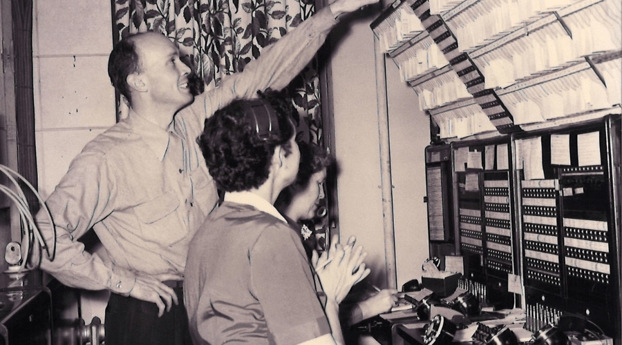 Bill Curtin with telephone operators and equipment.