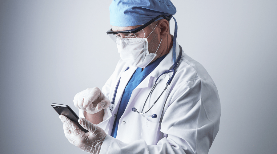 An on-call doctor receives a text message via a secure messaging app.
