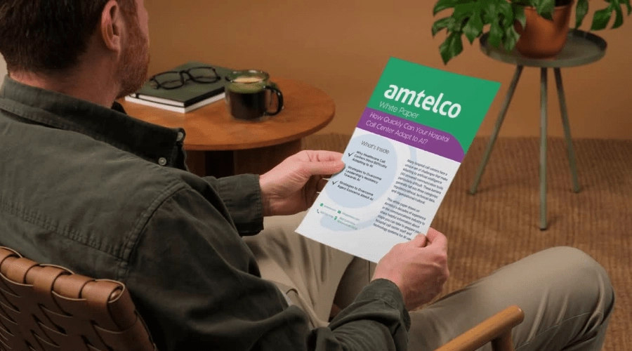 A man reads an Amtelco white paper.