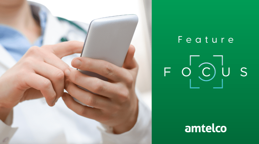 A doctor receives a page on her mobile phone.