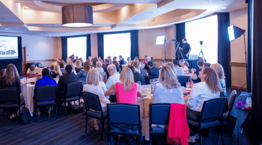 Room full of people attending a conference.