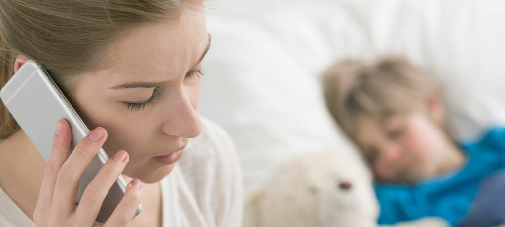 Mother calling healthcare call center for sick child